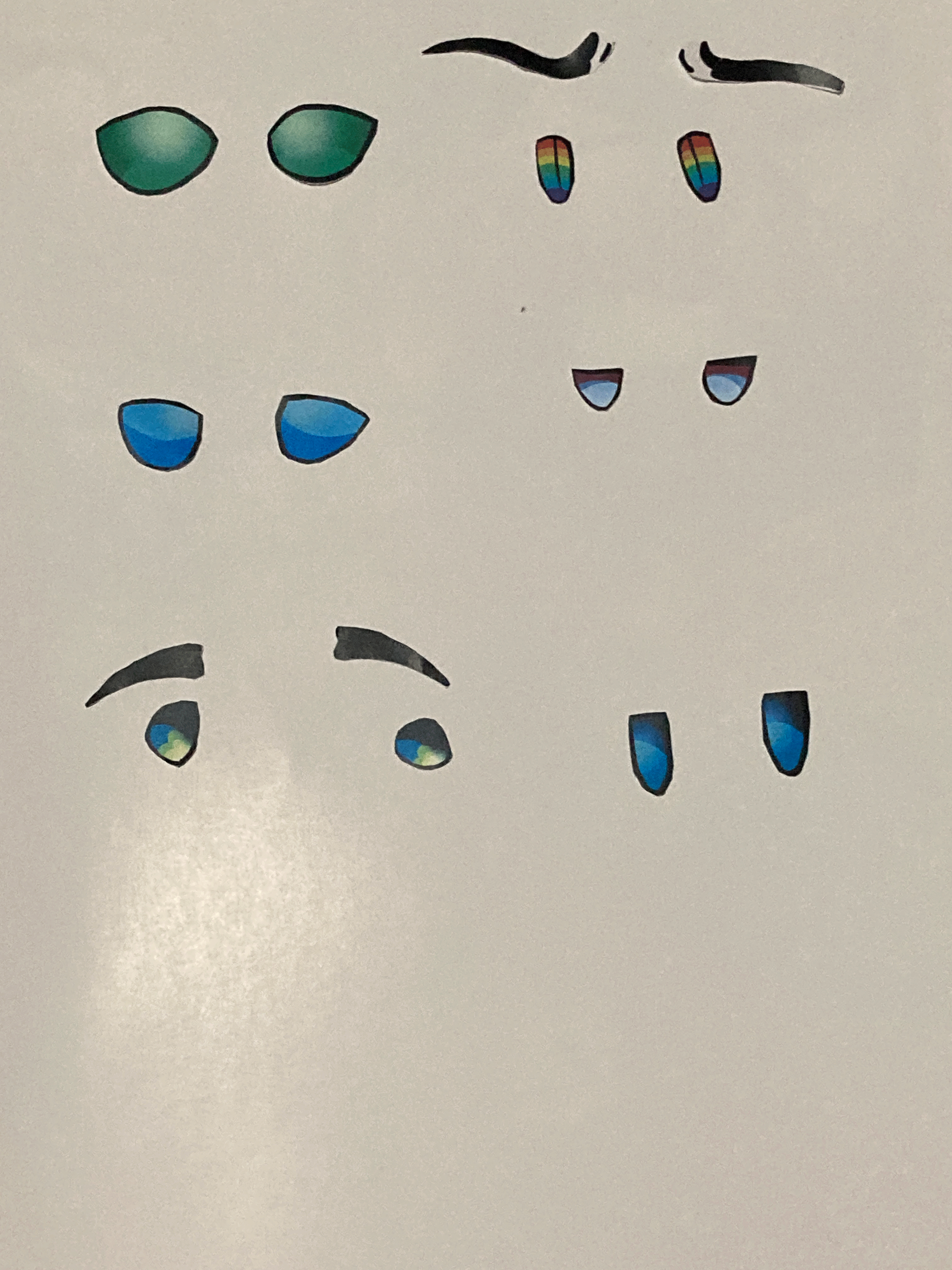 The eyes are cut out seperately and are captured on top of a white piece of paper.