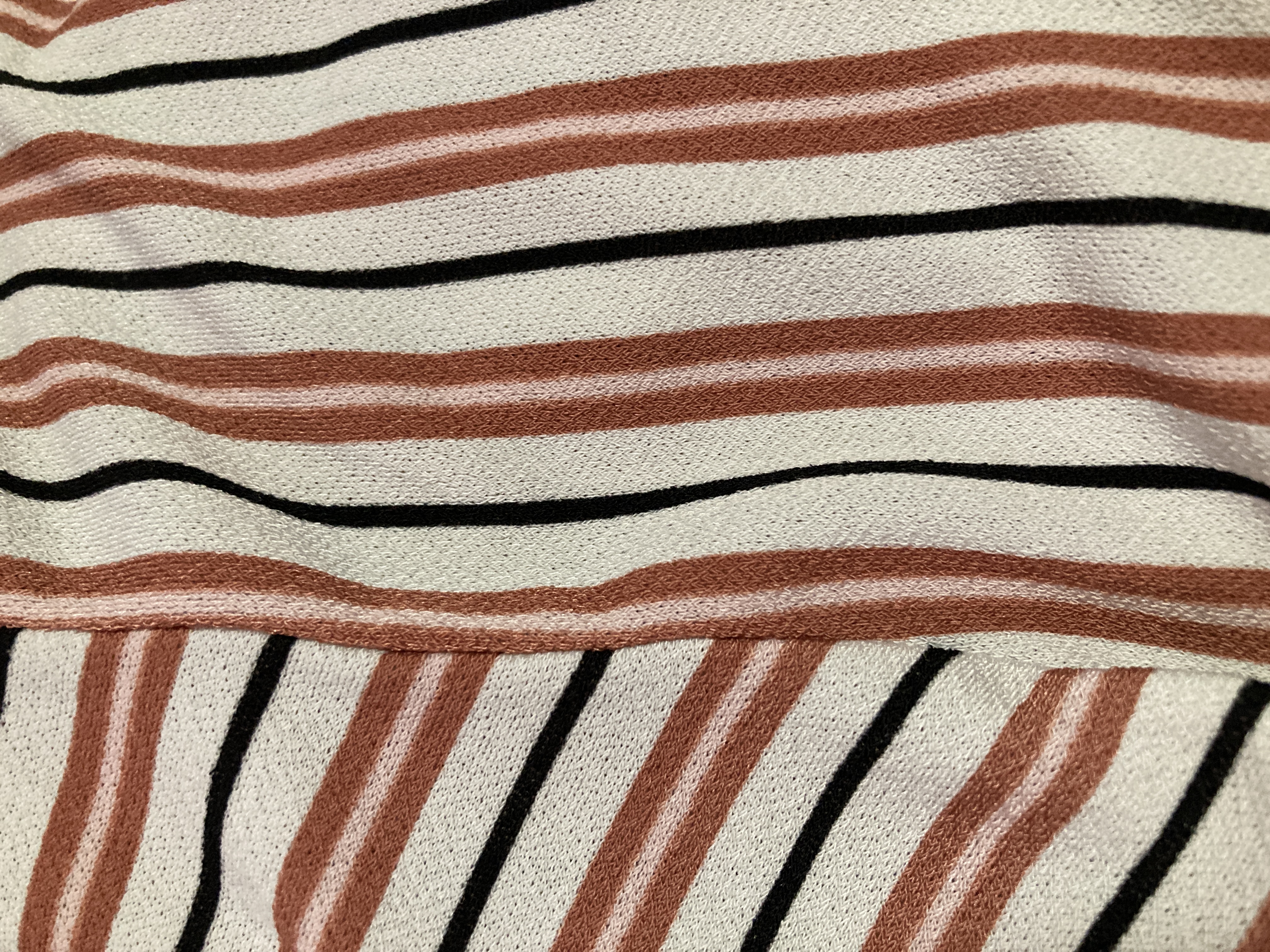 An upclose of a striped shirt.